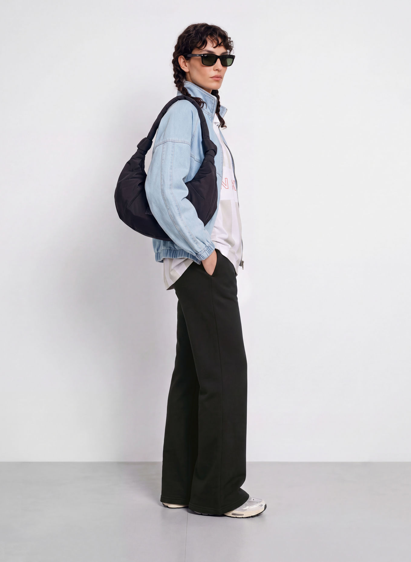 Nike Spodnie dresowe STUDIO FLEECE: CZARNY