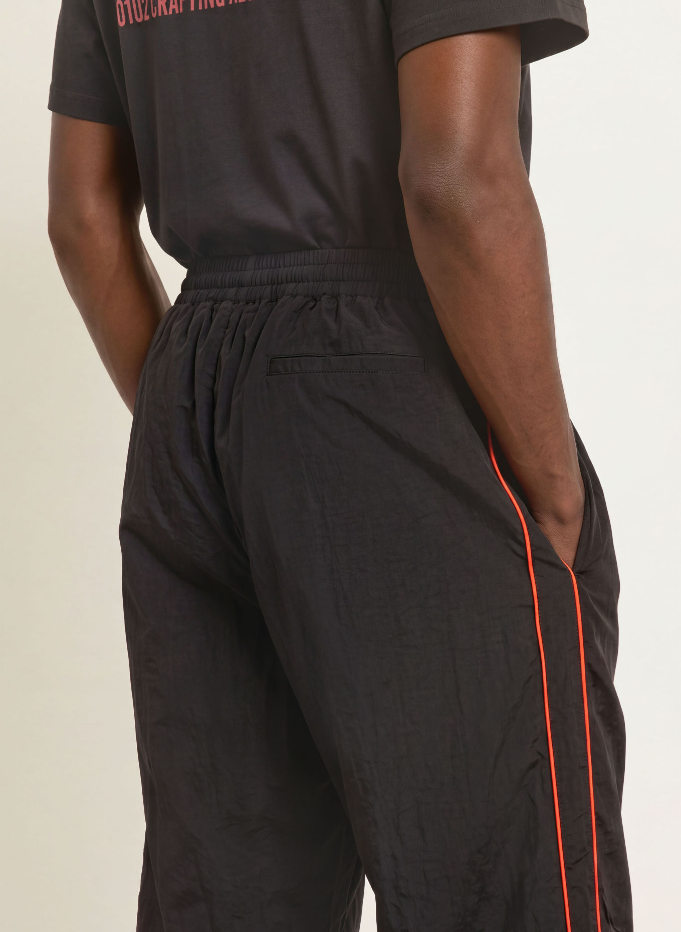 WRSTBHVR JALE Training Pants with Braided Stripes: BLACK / RED