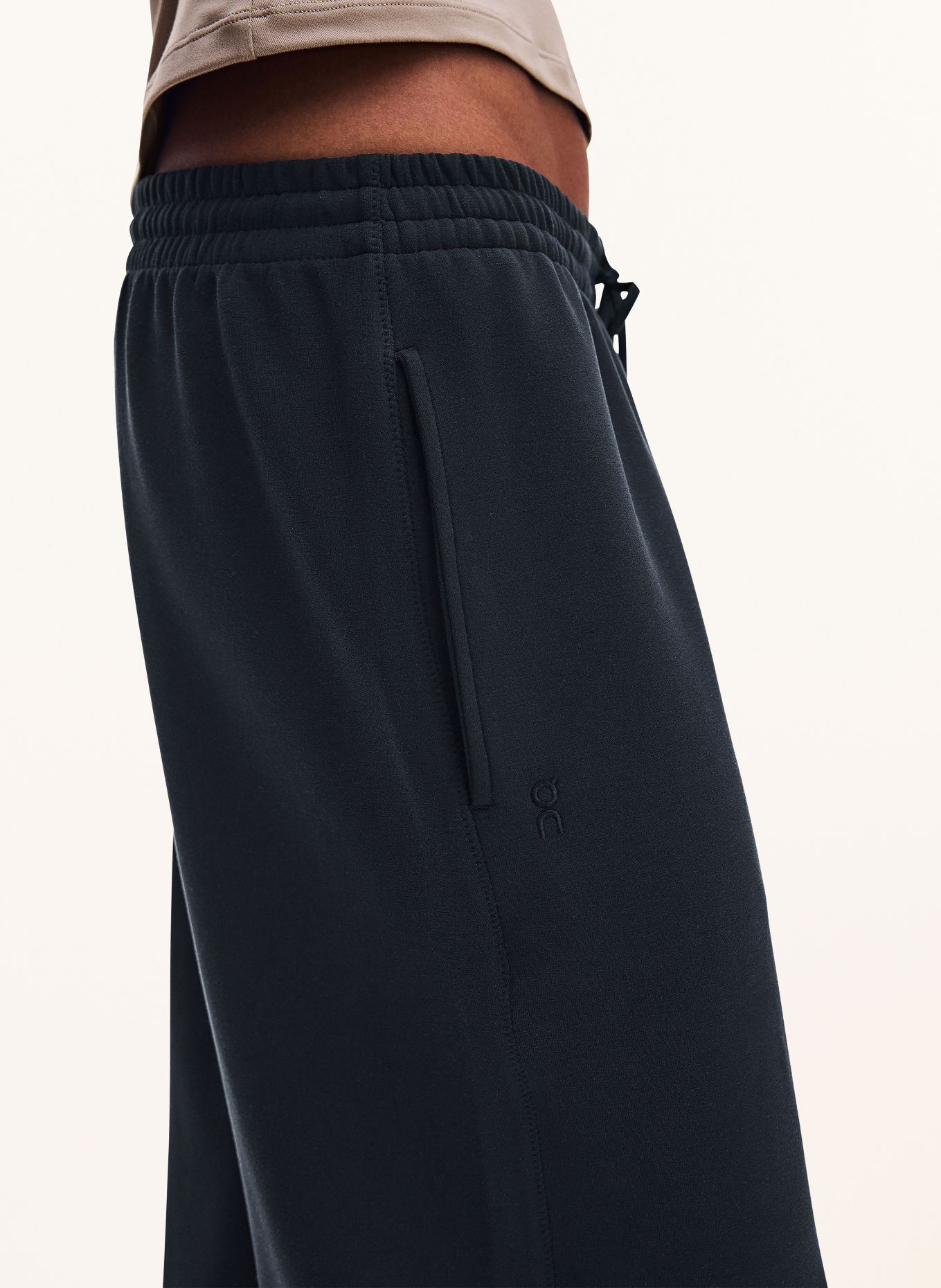 On STUDIO Training pants: BLACK