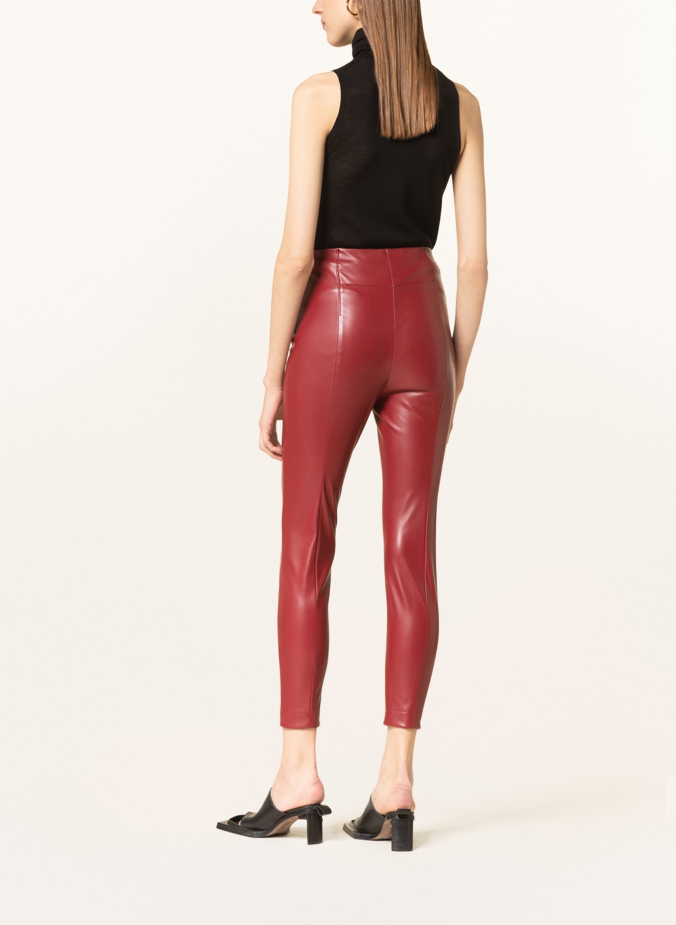 wearing dark red colour leather leggings pant