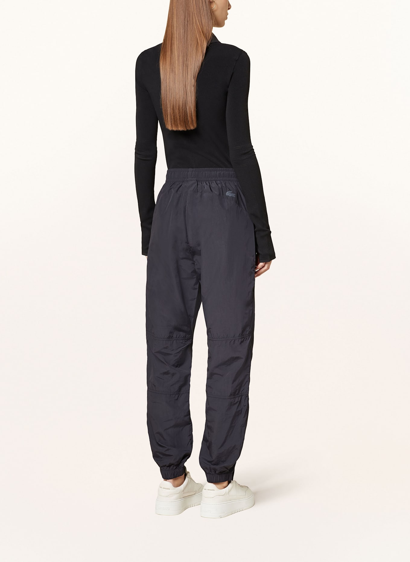 Black lacoste track pants sales