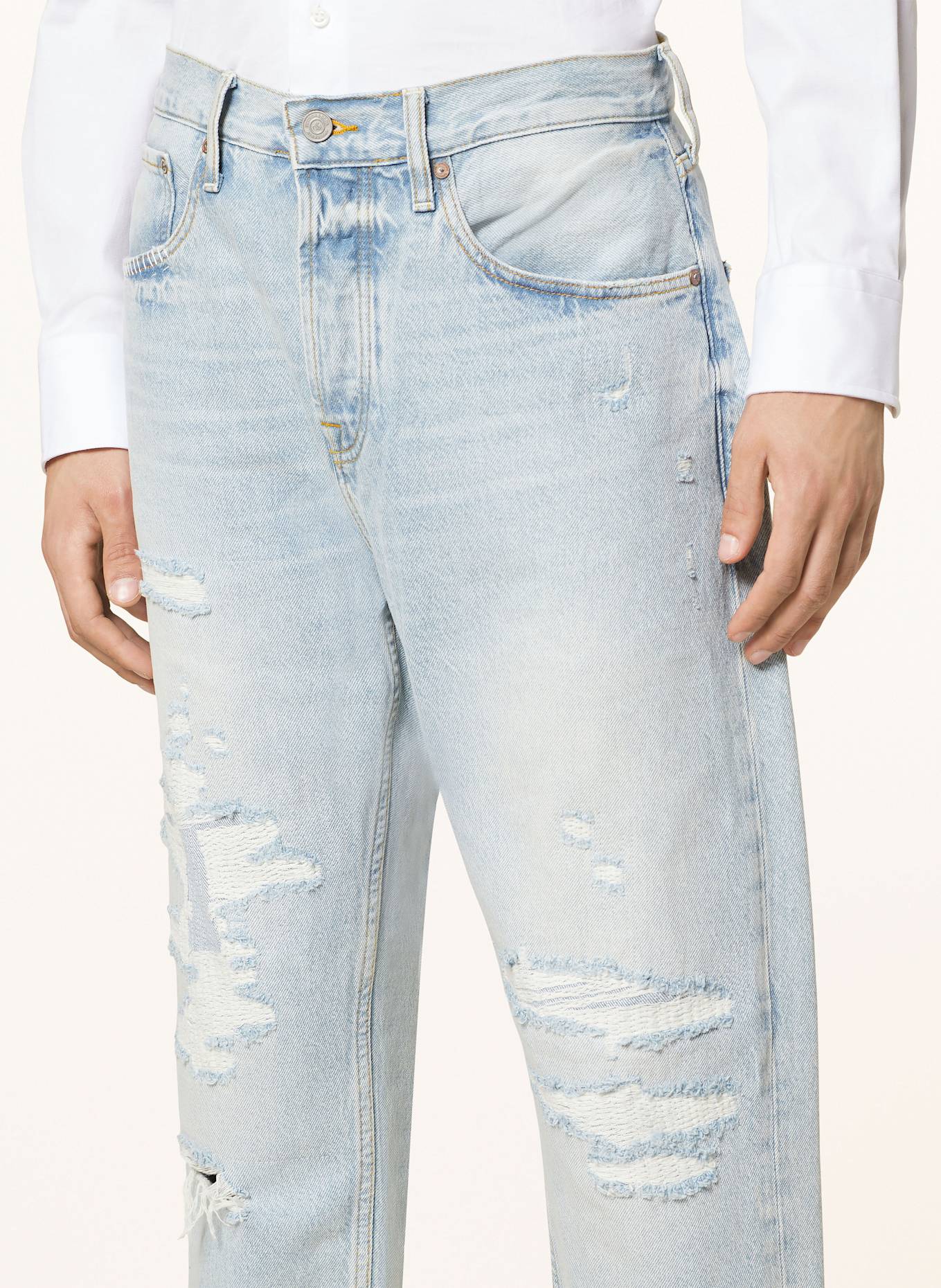 Tapered distressed jeans hotsell