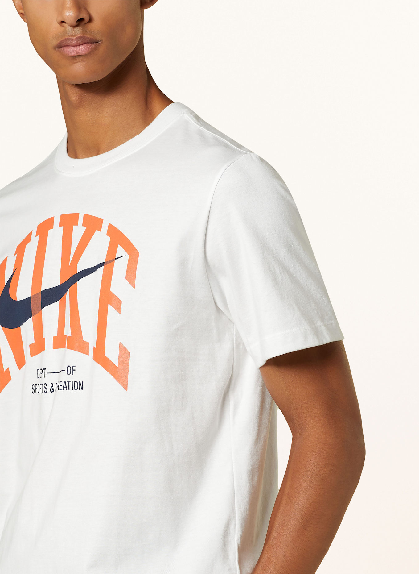 Nike T shirt in white orange black
