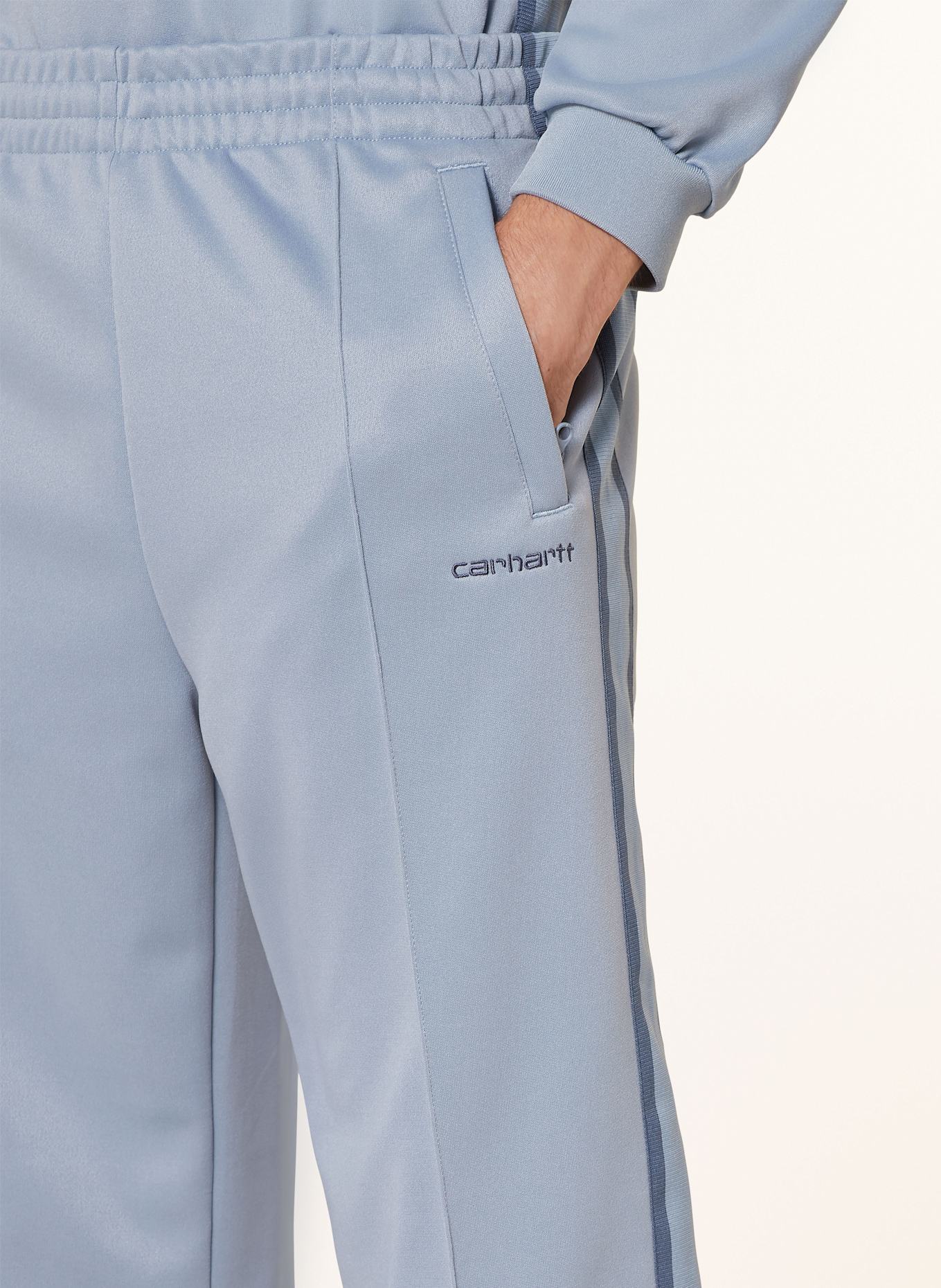 carhartt WIP Track Pants BOLAN mit Galonstreifen in hellblau blau