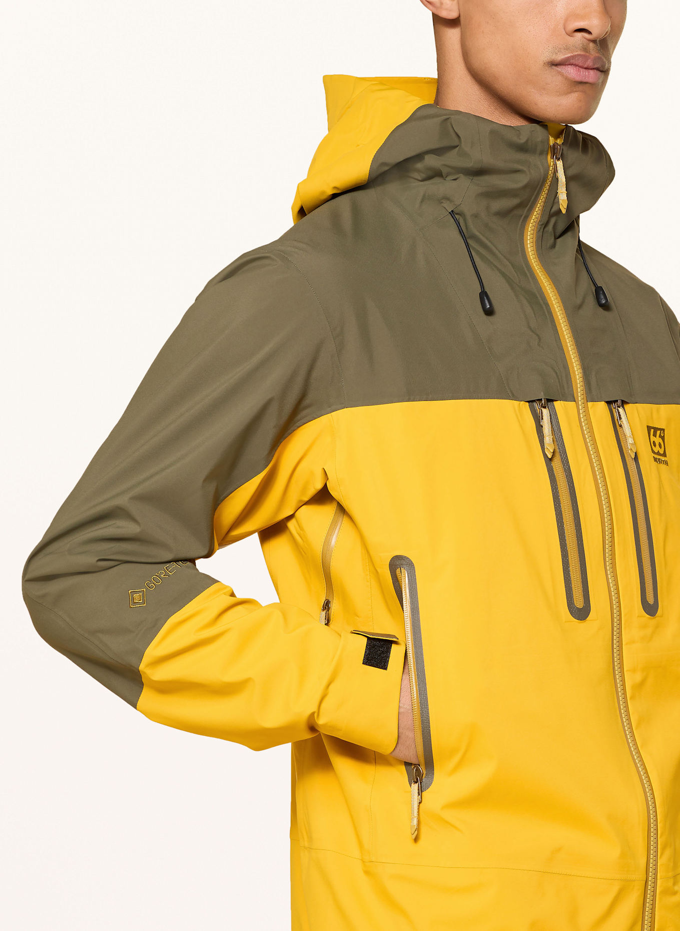 66°NORTH Hardshell-Jacke TRÖLLASKAGI GTX: DUNKELGELB / KHAKI