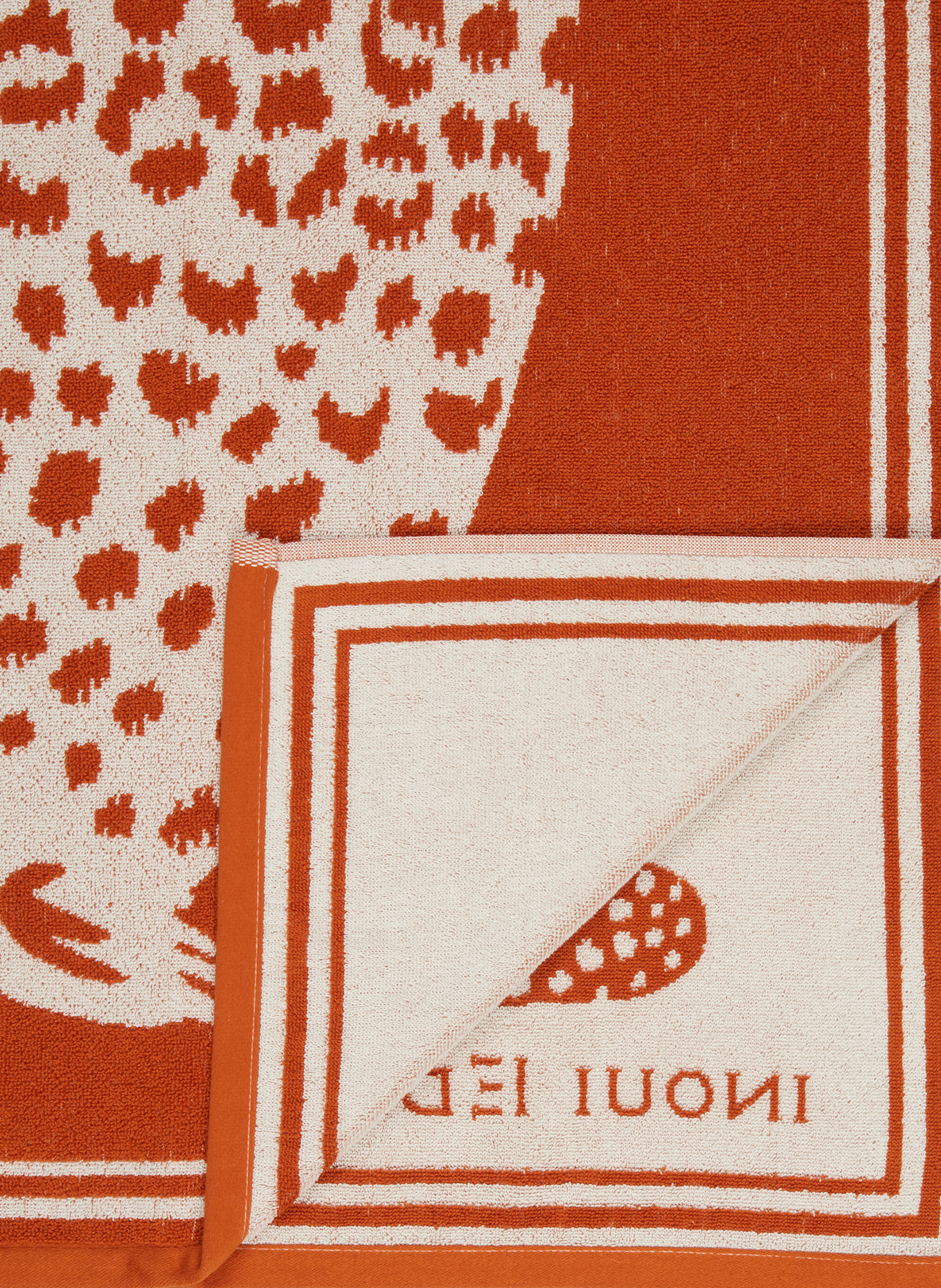INOUI EDITIONS Strandtuch LEO: DUNKELORANGE / CREME
