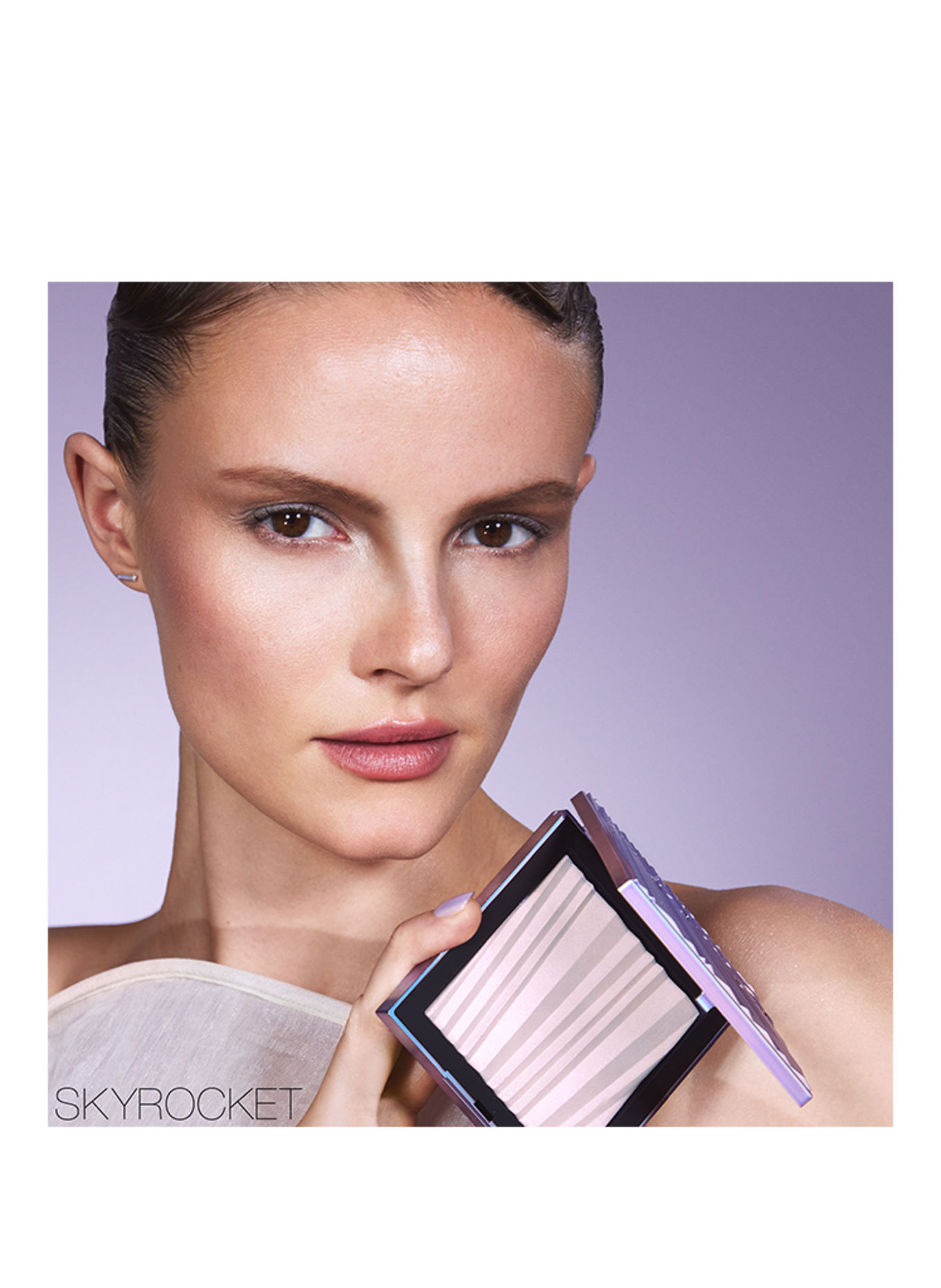 NARS AURA ILLUMINATING FACE & BODY LUMINIZING POWDER: SKYROCKET