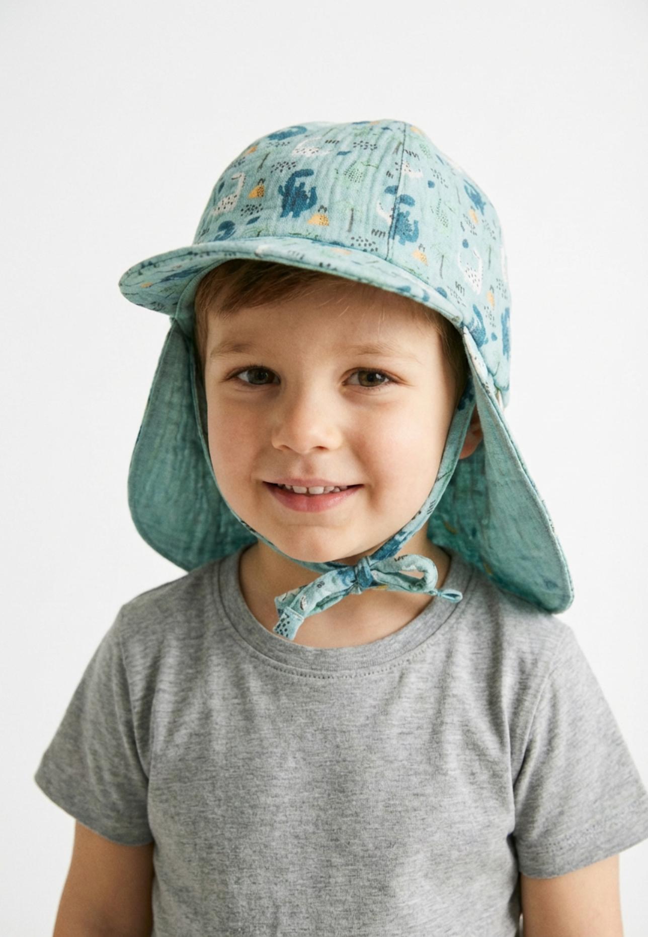 Sterntaler Schirmmütze mit Nackenschutz Dinos: TÜRKIS