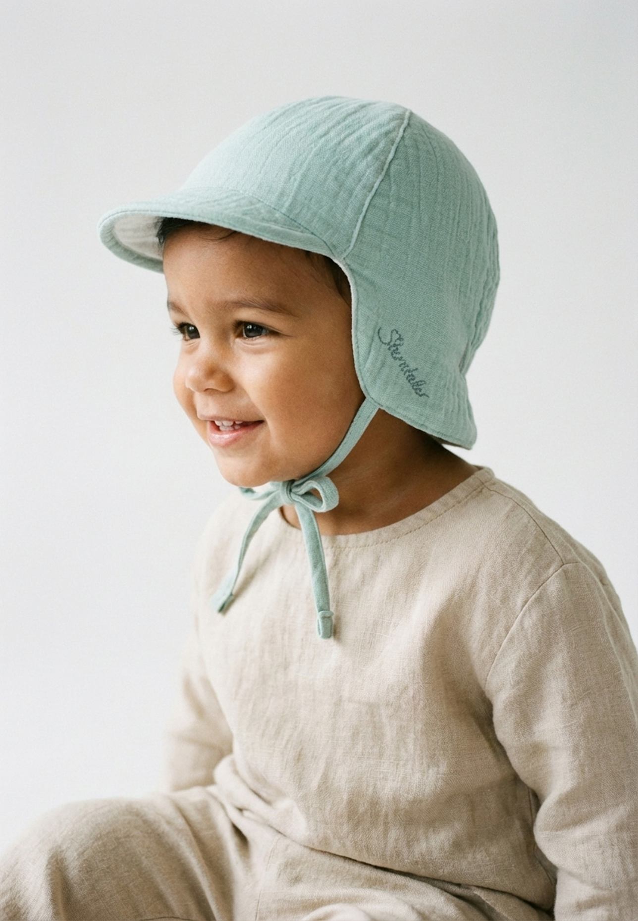 Sterntaler Schirmmütze mit Nackenschutz Wende: TÜRKIS