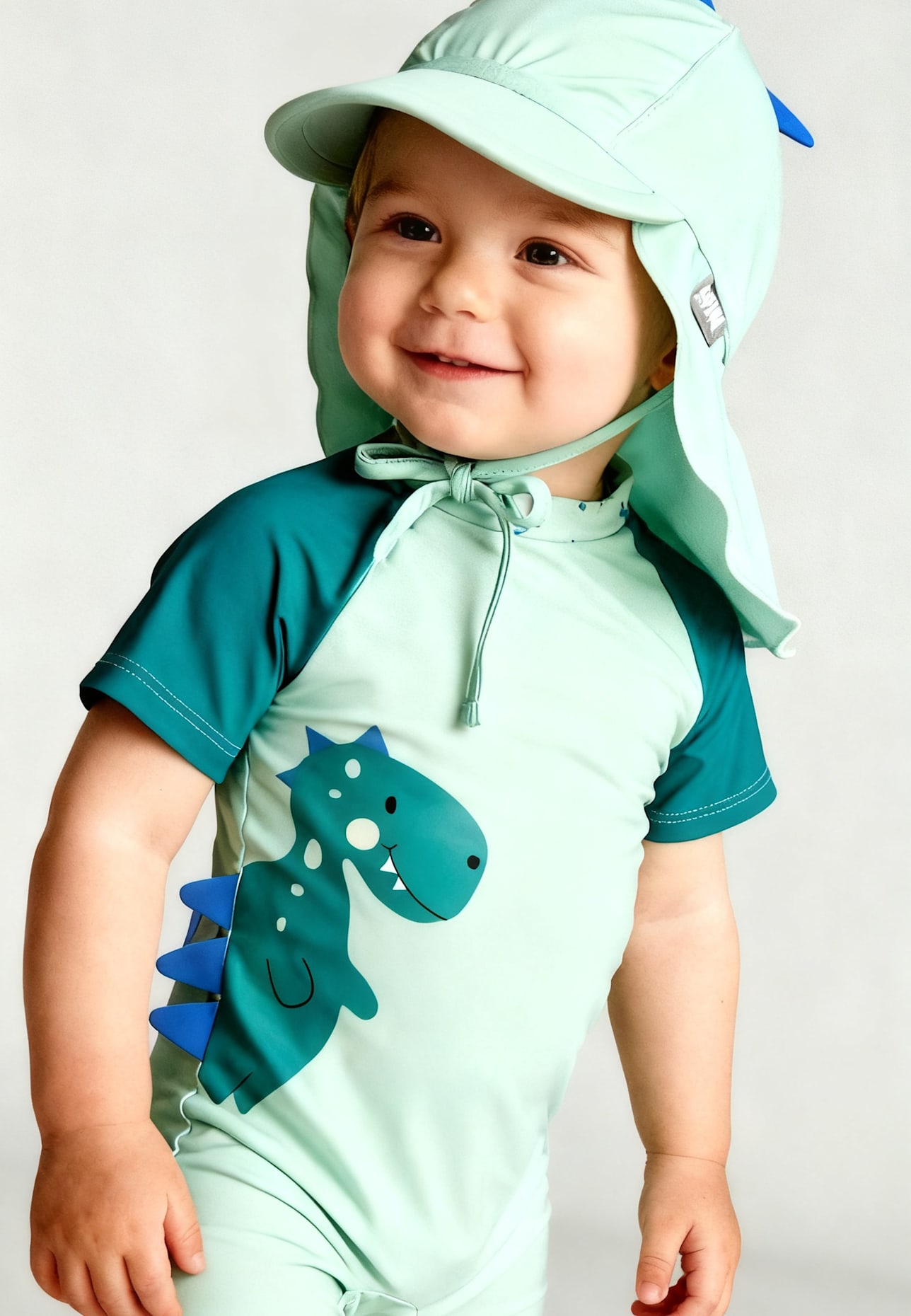 Sterntaler Schirmmütze mit Nackenschutz Dino: HELLGRÜN