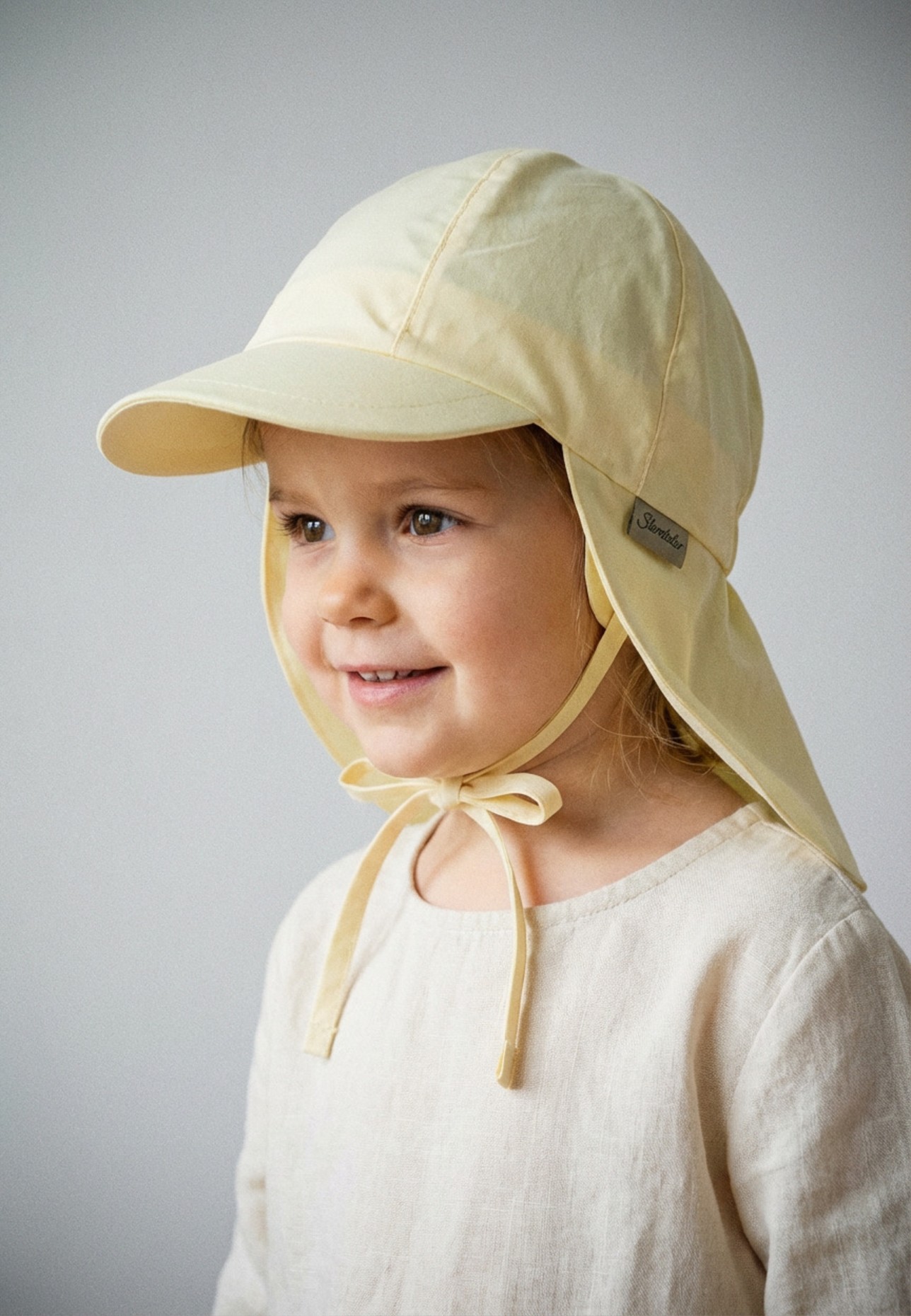 Sterntaler Schirmmütze mit Nackenschutz: GELB