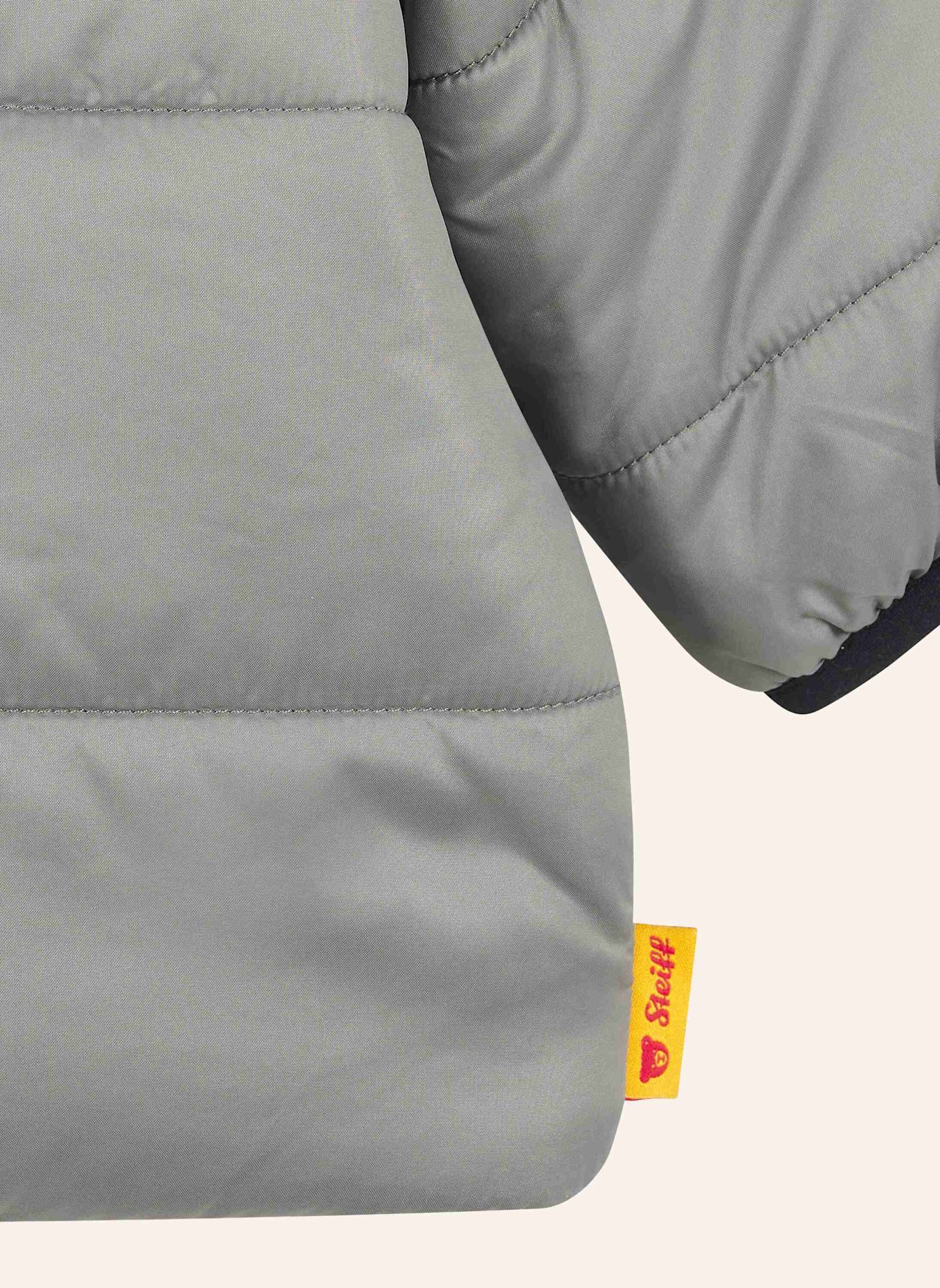 Steiff Jacke FESTIVE LUXE: GRAU