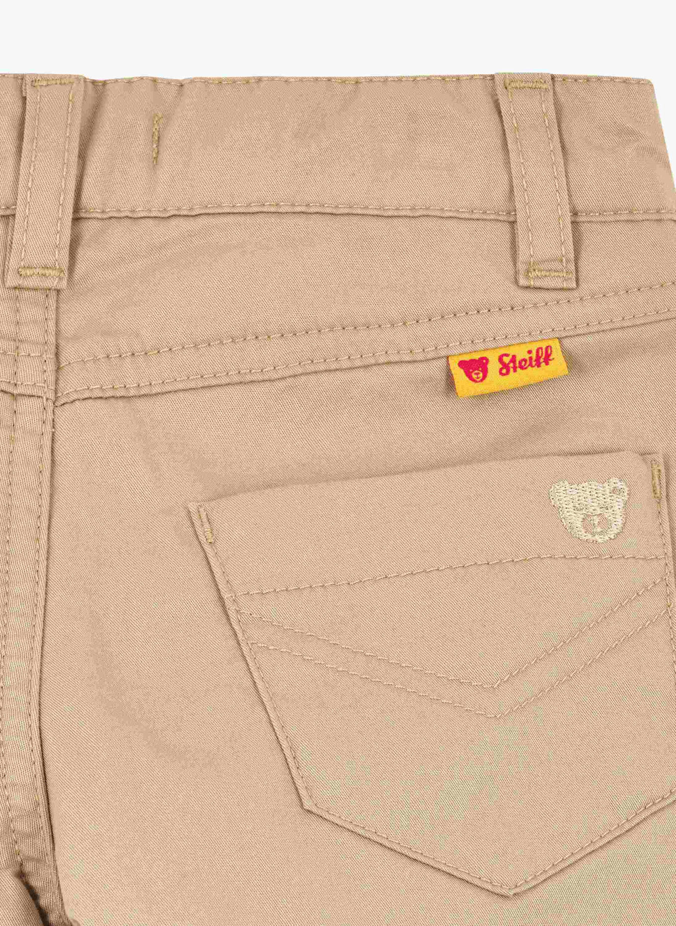 Steiff Hose DINOSAUR: BEIGE