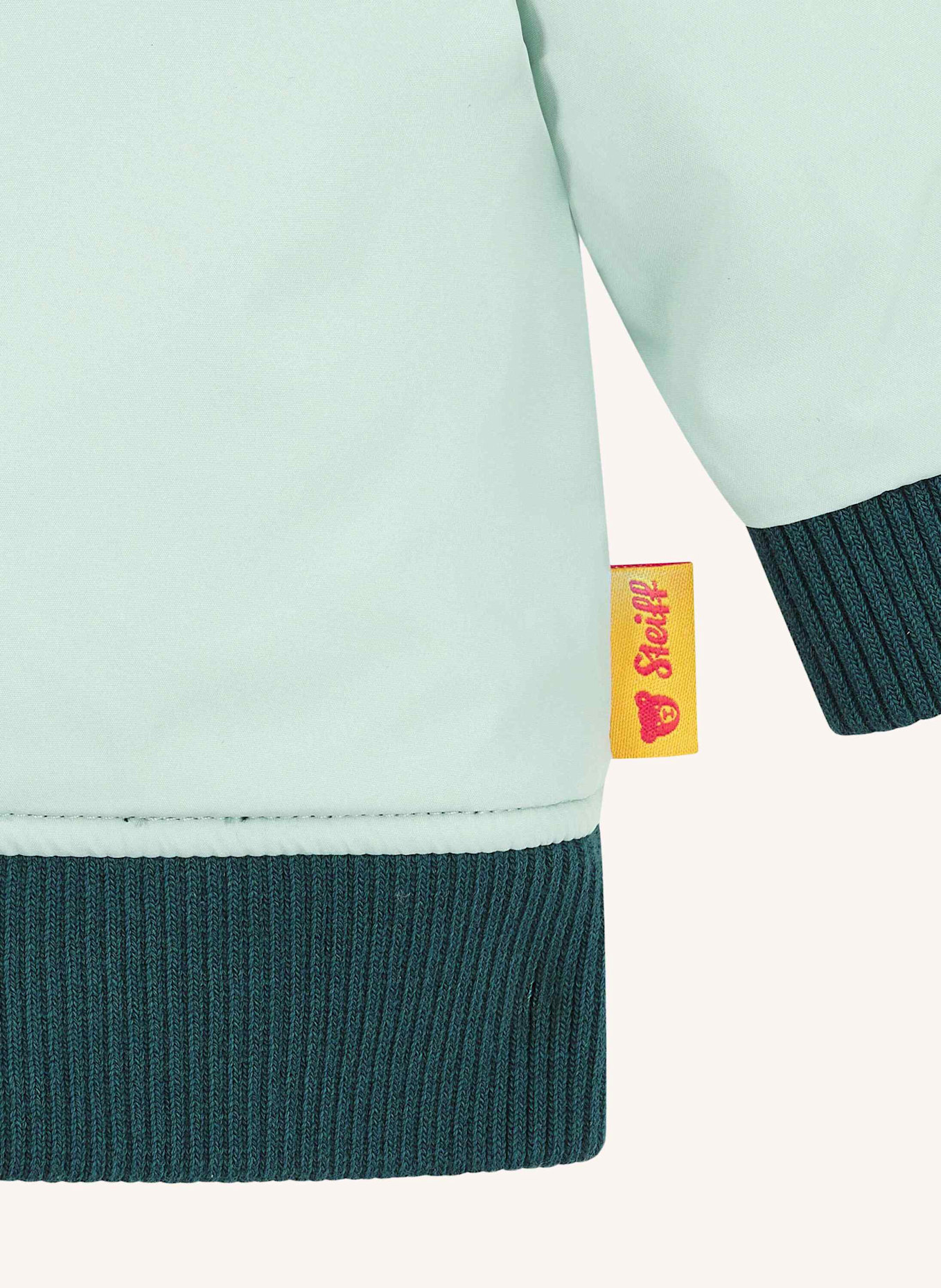 Steiff Wendejacke DINOSAUR: PETROL