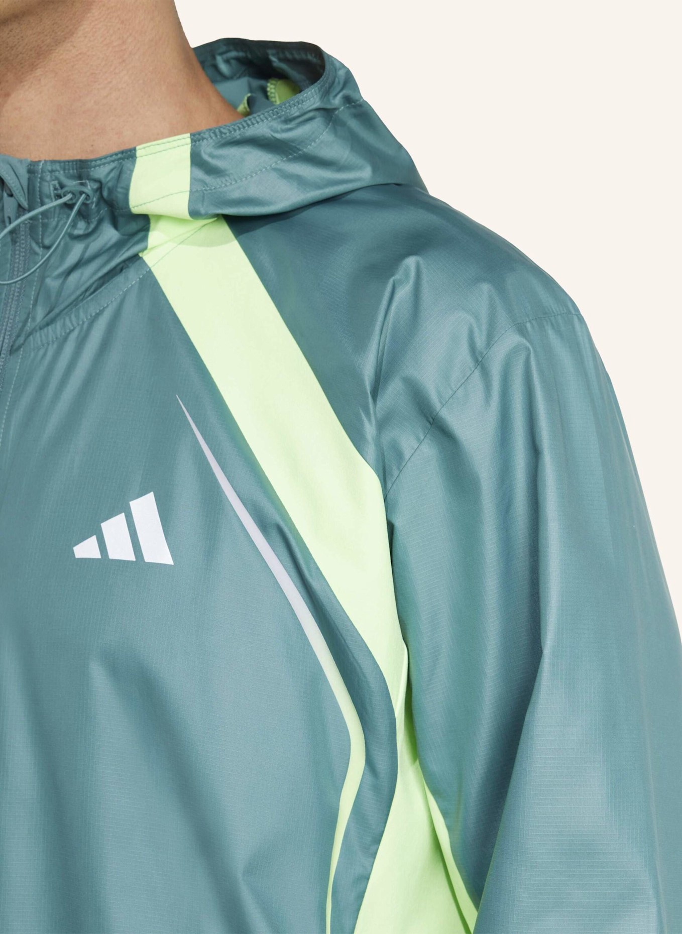 adidas TECH APPAREL WINDBREAKER: TÜRKIS/ NEONGRÜN