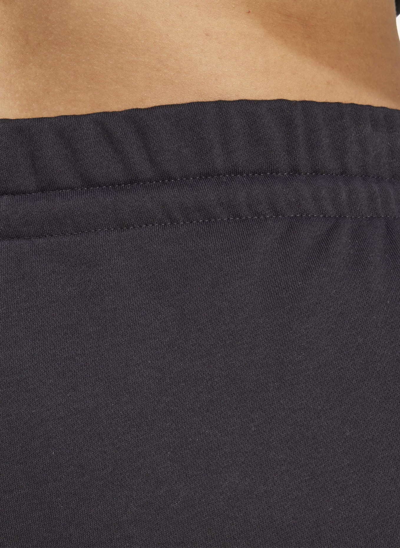 adidas ESSENTIALS 3-STRIPES FLEECE SLIM HOSE (GROSSE GRÖSSEN).: SCHWARZ/ WEISS