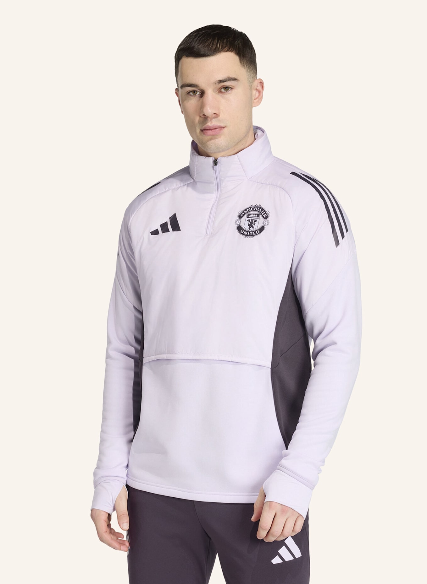 adidas MANCHESTER UNITED TIRO 25 COMPETITION WINTERIZED OBERTEIL: LILA/ SCHWARZ