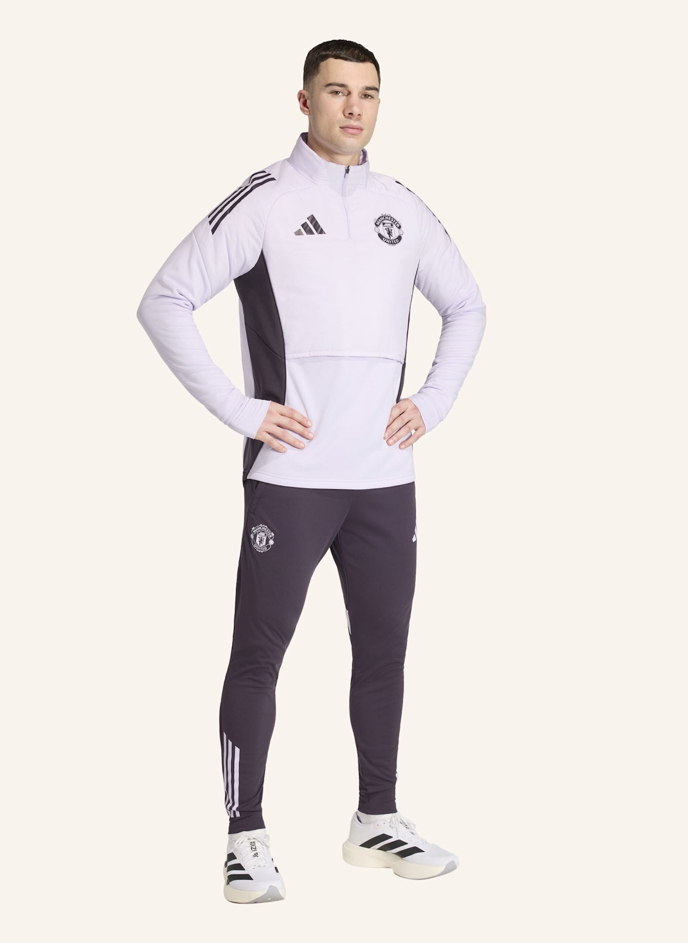 adidas MANCHESTER UNITED TIRO 25 COMPETITION WINTERIZED OBERTEIL: LILA/ SCHWARZ