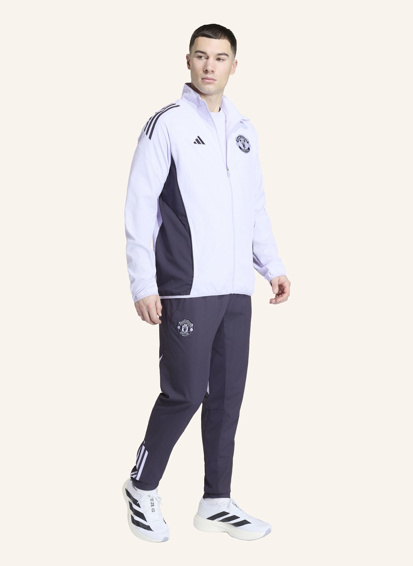 adidas MANCHESTER UNITED TIRO 25 COMPETITION PRÄSENTATIONSJACKE: LILA/ SCHWARZ