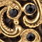 GOLD/ SCHWARZ